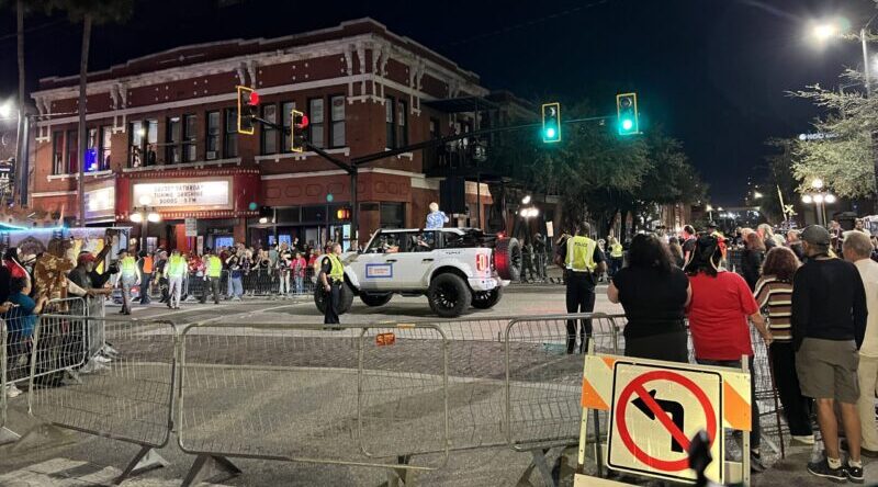 A crowd is gathered on the street to watch the Knight Parade. Photo Credit: Justin Michael