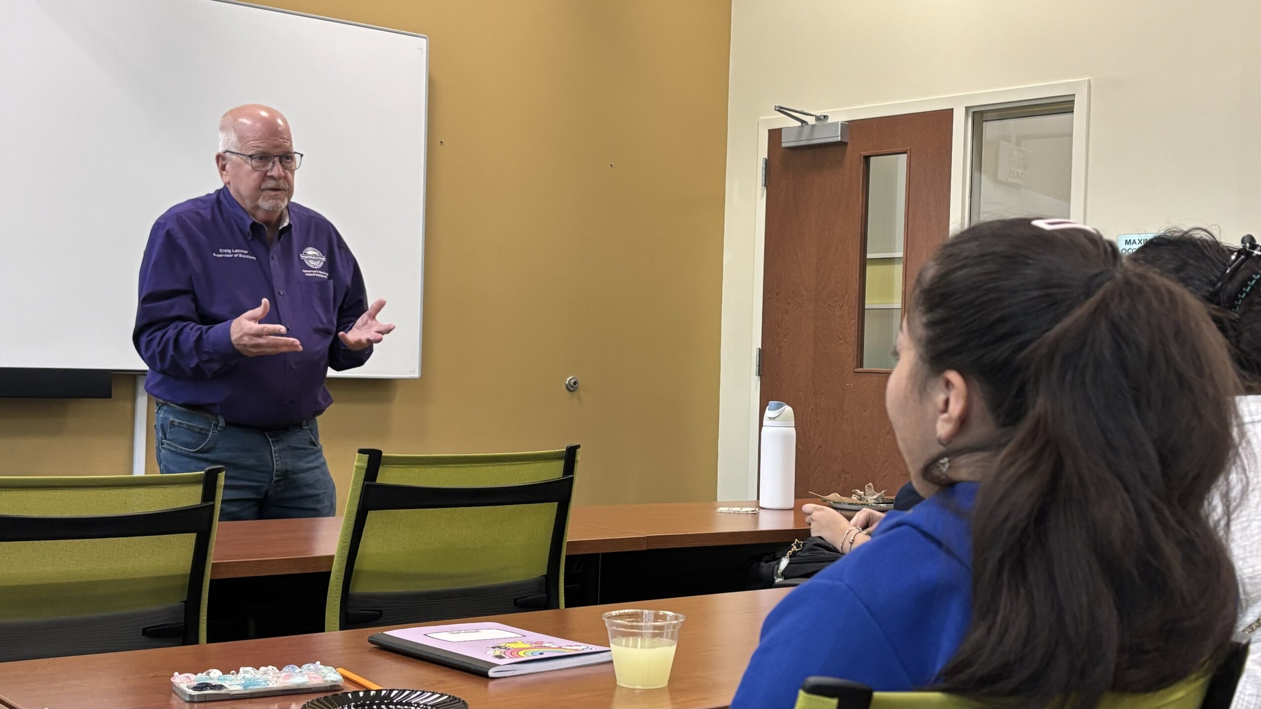 Latimer speaks to USF students about voting deadlines and advantages of early voting.