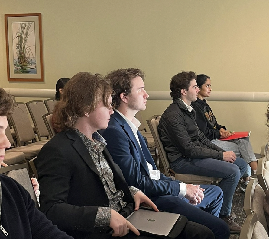 Vice President John Miller watches a fellow member during his presentation. Photo by Edison Khanthavong