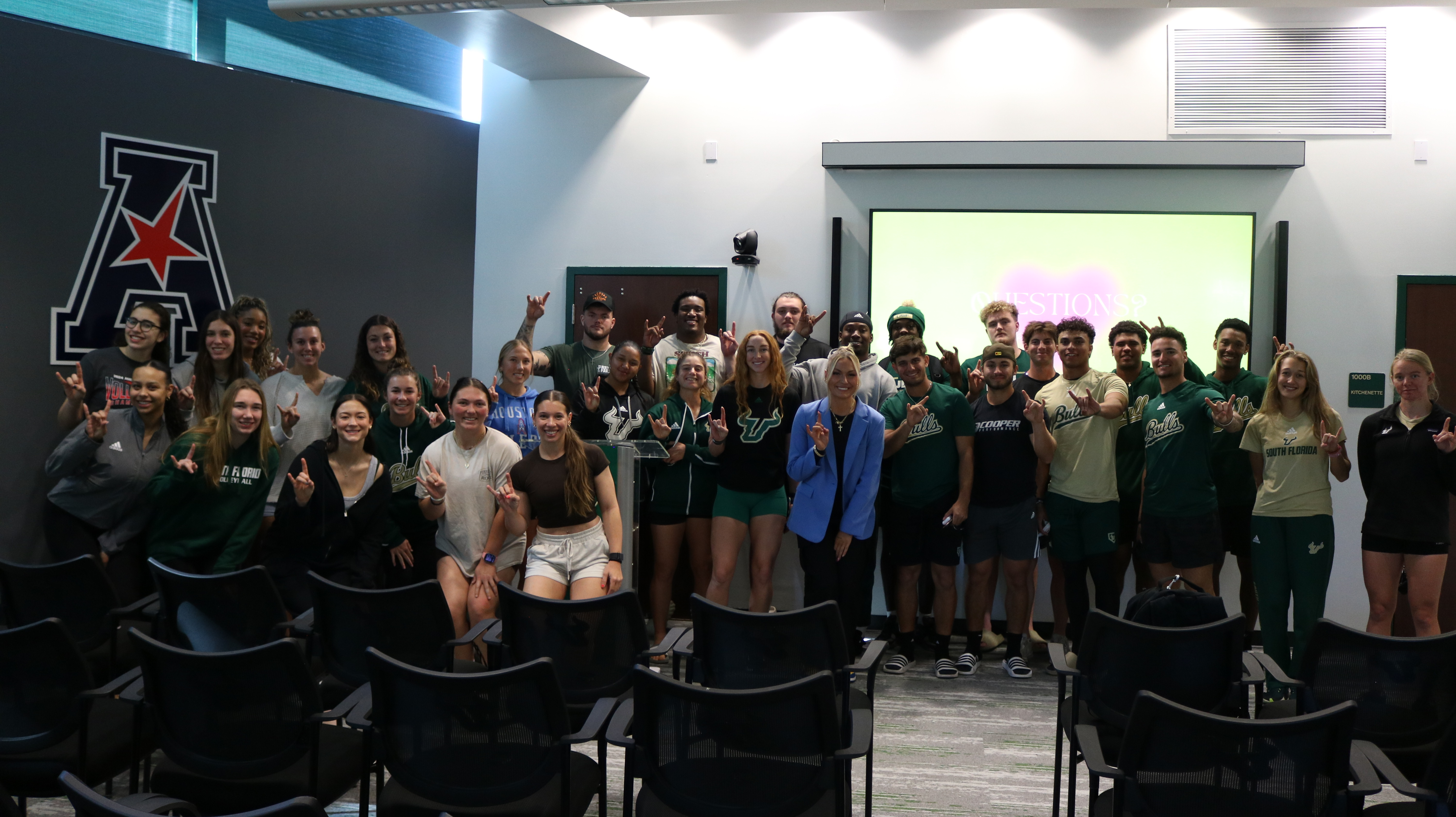 Student Athletes gather around Rose Cavelry, a speaker at one of the BOOST Symposium sessions.