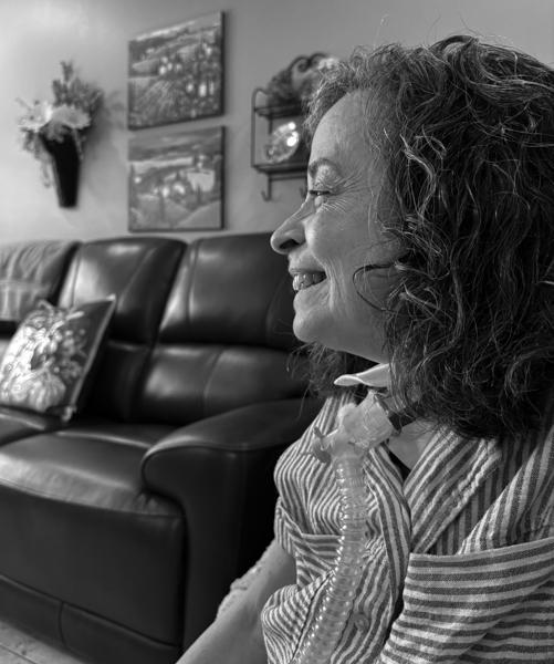 Side view of woman smiling.
