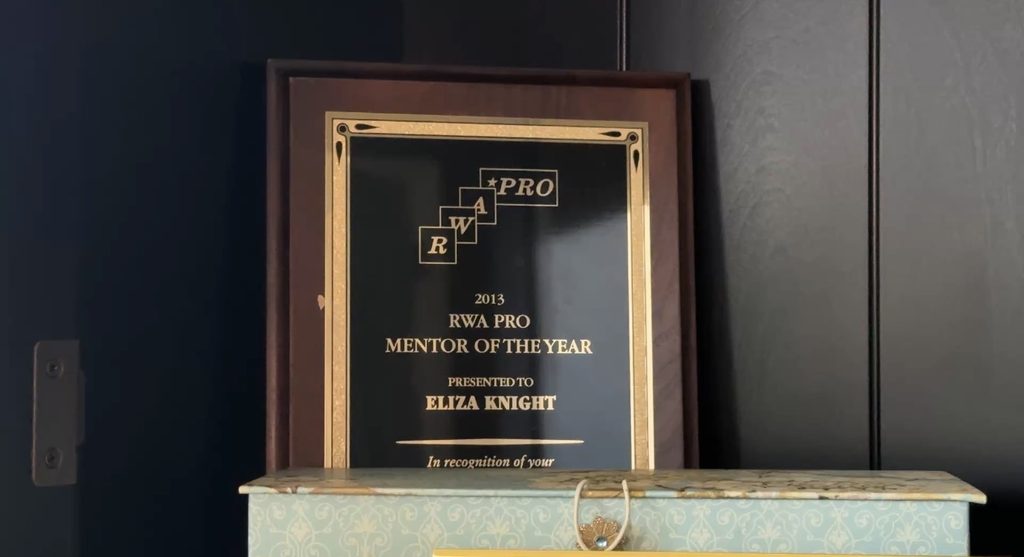 Eliza Knight won RWA Pro Mentor of the Year in 2013, which she has featured in her office.