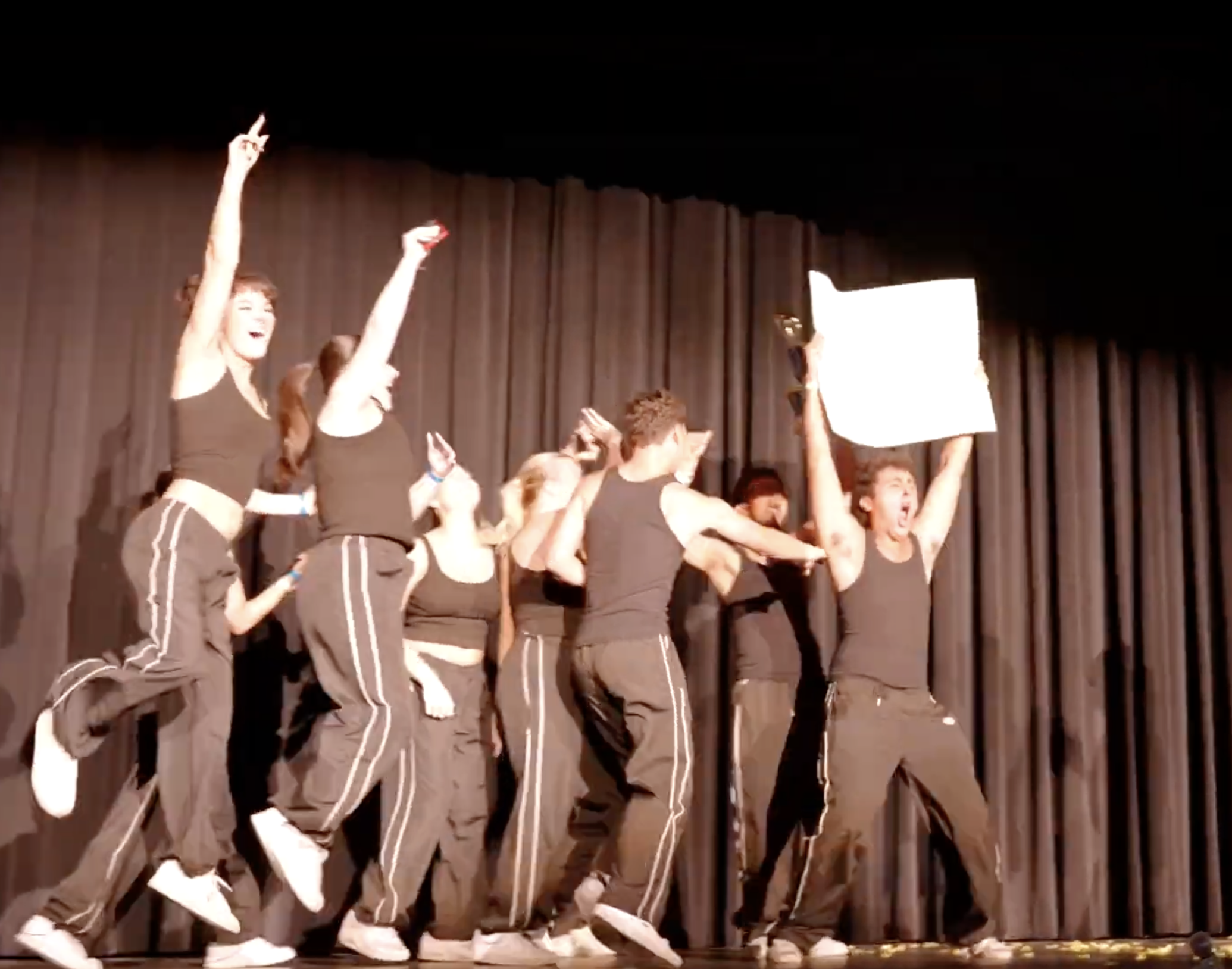 This is a photo of partcipating members storming the stage after they win.