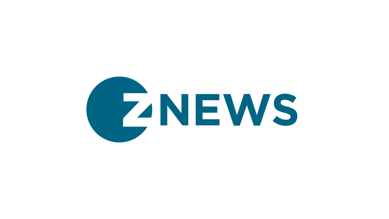 A while background with the word in blue font Z news.